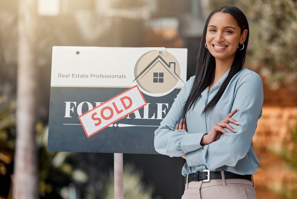Arms,crossed,,sold,sign,and,portrait,of,realtor,woman,in